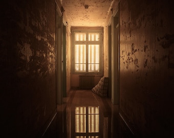 Chiaroscuro photography of a flooded abandoned corridor in Normandy, France