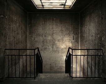 Chiaroscuro photography of stairs in an abandoned hospital in France