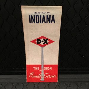 May include: A vintage road map of Indiana, featuring a red and white D-X sign with the text "The Sign of Friendly Service".