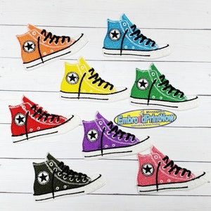 May include: Embroidered patches of high-top sneakers in various colors: orange, blue, yellow, green, red, purple, black, and pink. Each patch features a white sole, black laces, and a star emblem.