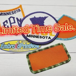 May include: Assortment of embroidered patches with various designs, including a state outline, text, and a blank patch. The patches are orange, blue, green, and purple. The text on the patches reads "Minnesota" and "Limited Time Sale."