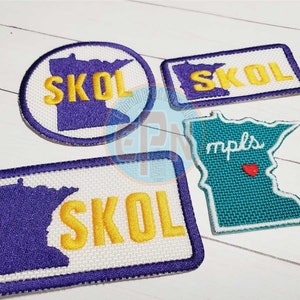 May include: Four embroidered patches featuring the state of Minnesota. One patch is a circle with the state outline and the word "SKOL" in yellow letters. Another patch is a rectangle with the state outline and the word "SKOL" in yellow letters. The third patch is a rectangle with the state outline and the word "SKOL" in yellow letters. The fourth patch is a teal blue outline of the state with the word "mpls" in white letters and a red heart.