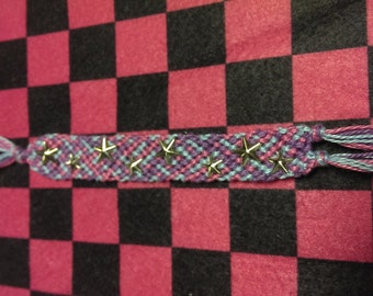 galaxy inspired friendship bracelet with metal stars