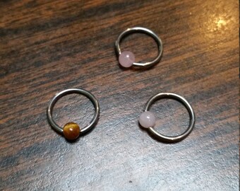 scelta dell'anello prigioniero del branello cbr quarzo rosa o occhio di tigre