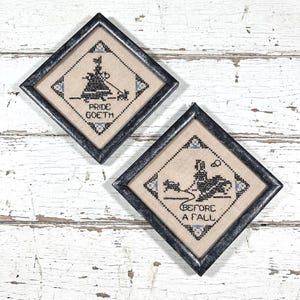 Wall Art, Two Framed Cross Stich Fabric - Pride Goeth Before a Fall