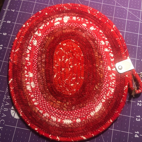 Oval Shaped Coiled Clothesline Trivet in multiple Red and White Cotton Batiks/Prints Trivet #78 - 9.5” x 8” in size medium