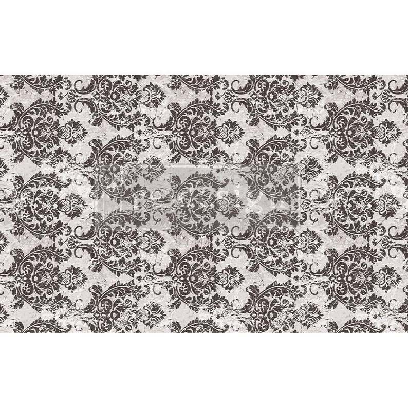 May include: A distressed, vintage-style pattern featuring a repeating damask design in dark brown against a light grey background. The ornate, swirling floral motifs create a classic, textured look, suitable for home decor or craft projects.