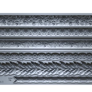 May include: A gray silicone mold with six different decorative trim designs. The mold is labeled "IOD TRIMMINGS 1" and includes measurements in milliliters and grams for each design.
