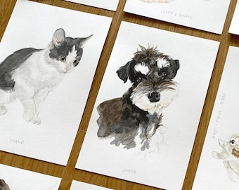 May include: A collection of watercolor paintings featuring various dog and cat breeds. Each painting is framed with a white border and includes the name of the animal in a handwritten font.
