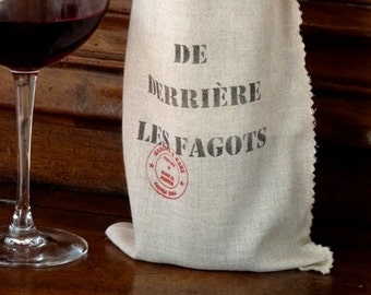 2 Paquets cadeau pour une bouteille. "De derrière les fagots", en lin naturel, ficelle lin rouge.