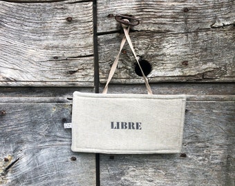 Señal reversible de Ocupado-Libre, fabricada en lino.