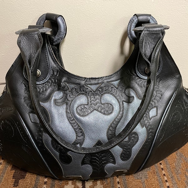 Leaders In Leather, Beautifully Cutout, Tooled Shoulder Bag, Excellent quality, and Classic, Boho Chic Western. Color Black/Silver