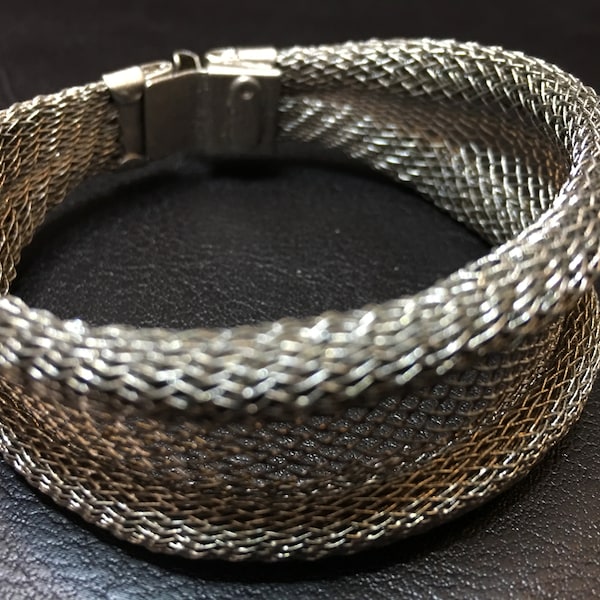 Bracelet ~ Wire Mesh Bracelet Soft wire mesh is formed, and finish with a light industrial silver clasp. Artist: Sarah Cavender