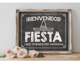 May include: A white framed chalkboard sign with the text "¡BIENVENIDOS! FIESTA LIKE THERE'S NO MAÑANA" in white chalk. A white sombrero is drawn above the word "FIESTA".