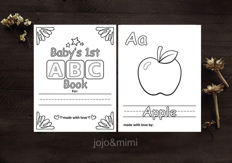 May include: A black and white printable coloring page for a baby's first ABC book. The page features a large letter A and an apple. The text "Baby's 1st ABC Book" is at the top of the page.