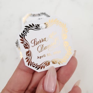 Gepersonaliseerde goudverijdelde labels voor bruiloftbedankjes Zwarte aangepaste hanglabels voor cadeauzakjes en gunsten Zilveren roségouden folie Luxe labels in achthoekige vorm