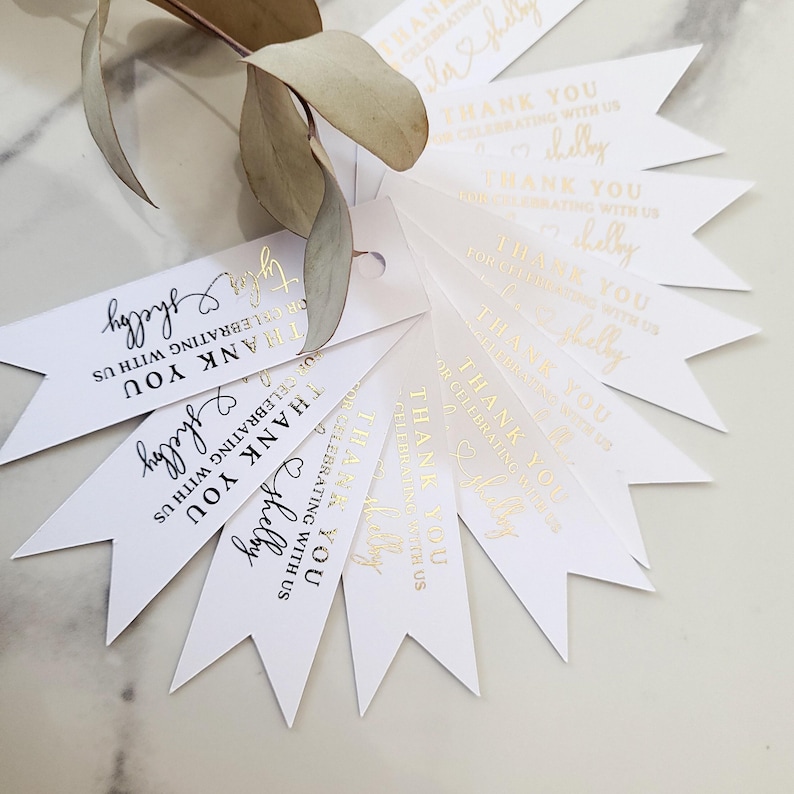 XOXOKristen gold foil Heart Connected Wedding Favor Tags featuring “Thank you for celebrating with us” and connected names with a heart symbol, printed on crisp white card — perfect for elegant wedding favors.