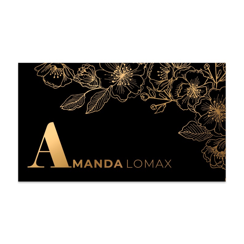 Black velvet business cards with a gold foil print. The design features gold floral decoration as a background. At the bottom in gold foiled print is written your name or business name.