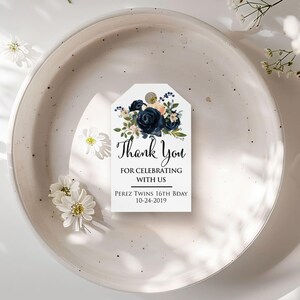 XOXOKristen personalized Navy Floral Thank You Tags attached to a linen favor bag with twine, showing the static “Thank You for Celebrating with Us” message in elegant script.