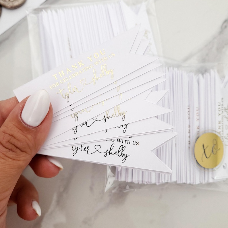 XOXOKristen gold foil Heart Connected Wedding Favor Tags featuring “Thank you for celebrating with us” and connected names with a heart symbol, printed on crisp white card — perfect for elegant wedding favors.