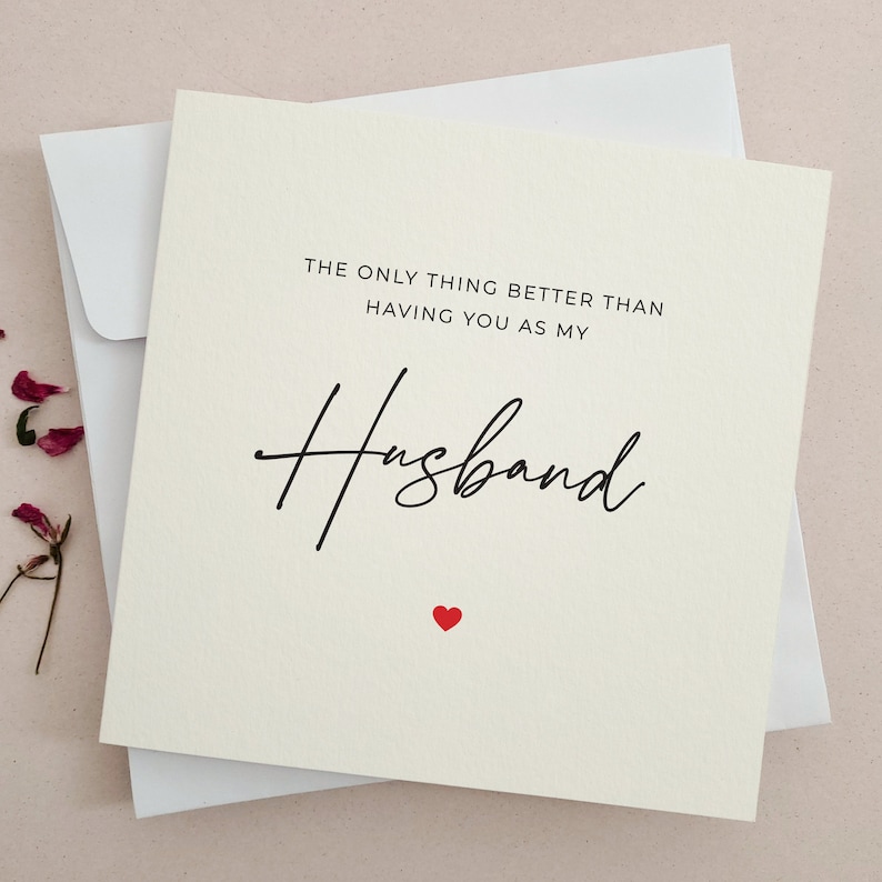 May include: A white card with black text that reads 'The only thing better than having you as my husband.' The word 'husband' is written in cursive. There is a small red heart at the bottom of the card.