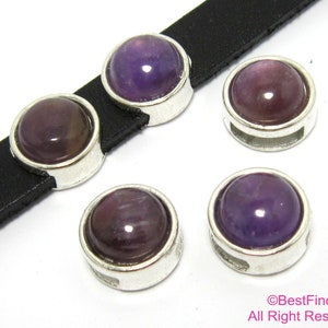 May include: Four silver-toned metal beads with a purple gemstone cabochon in the center. The beads have a hole for threading.