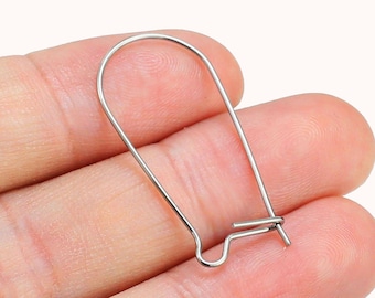 May include: Silver earring hooks, a pair of small, silver, open hoop earring findings with a hook closure.