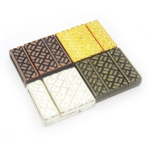 May include: Four metal clasps in different finishes: gold, copper, silver, and bronze. Each clasp has a textured, woven design.
