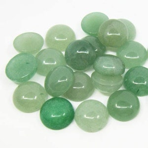 May include: A collection of 18 round, green, translucent gemstone cabochons. The cabochons are smooth and polished, with a slight variation in color and translucency.