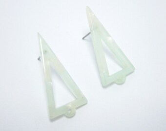 May include: A pair of triangle-shaped earrings made of translucent white plastic. The earrings have a hollow centre and are attached to silver posts.