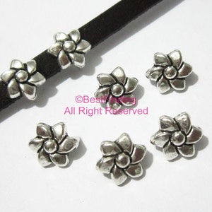 10 st 5 mm läderglidare, blompärlor, platta läderdetaljer, 5 x 2 mm, väderkvarnsglidare, läderarmbandstillverkning - FF213
