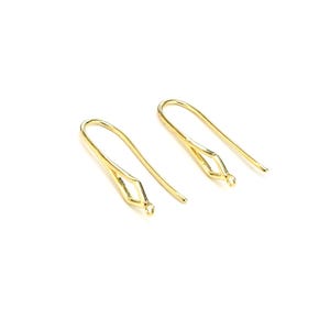May include: Two gold-toned earring hooks with a diamond-shaped opening at the top. The hooks are made of metal and are designed for attaching earrings.