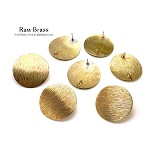 May include: A collection of circular raw brass earring components with a brushed metallic finish. The pieces feature attached earring posts and small loops for hanging. The text "Raw Brass Not Clean, Need to plating for use" is visible.