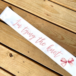 I’m tying the knot party sash / Gift / bridal shower / bachelorette party / bride to be / water color bow / pink glitter lettering / decor