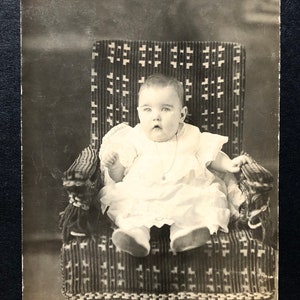 C. 1910 Photo, RPPC Baby Wearing Locket & White Dress on Rocker