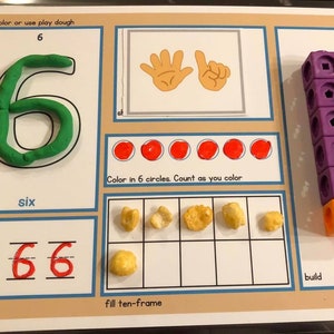 May include: A printable worksheet for learning the number six. The worksheet includes a green playdough number six, six red circles to color in, a ten-frame to fill with six objects, and a line to trace the number six.