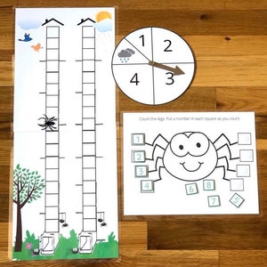 May include: A printable learning activity for kids featuring a spider with eight legs. The activity includes a spinner with numbers 1-4 and a counting sheet with squares to fill in with numbers.