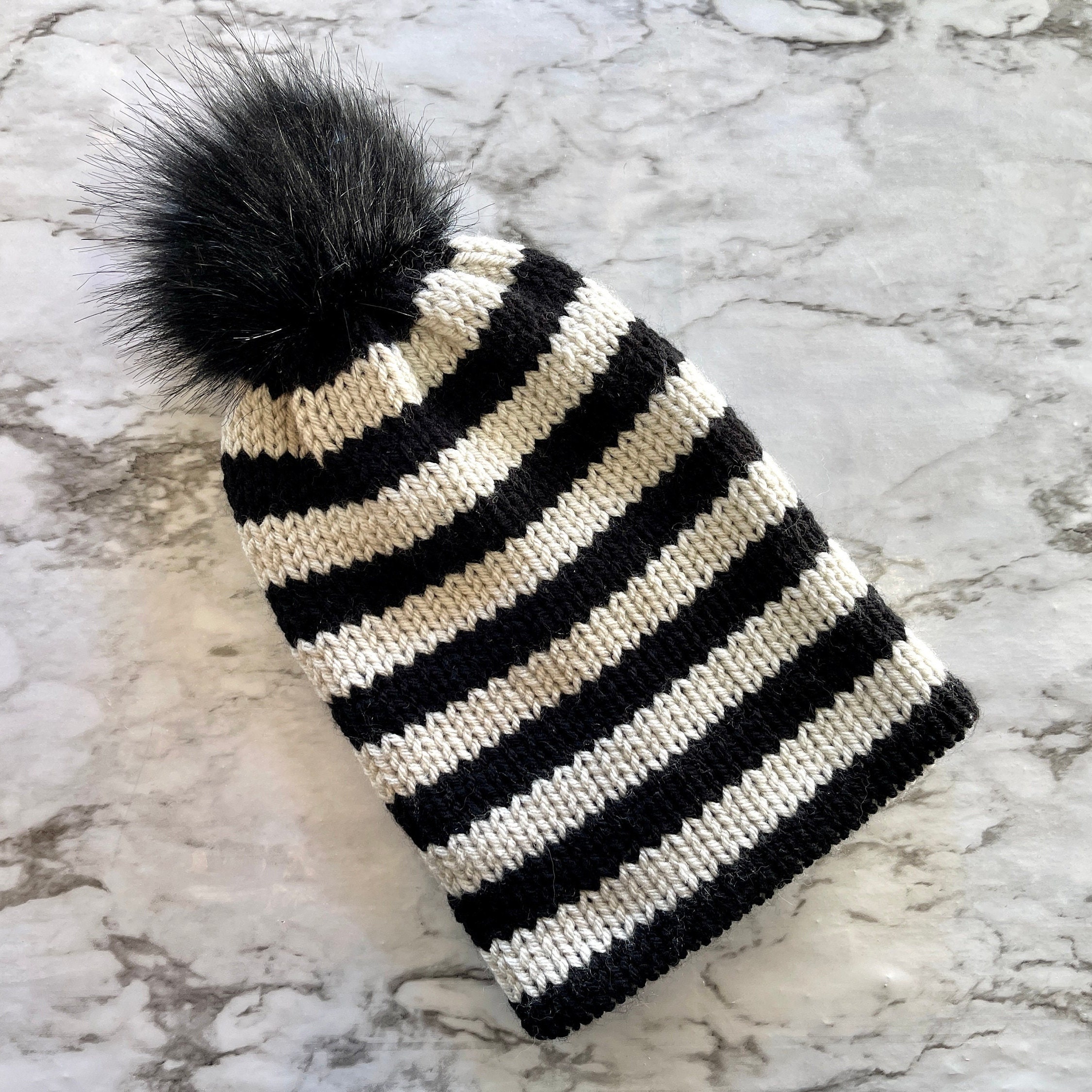 Lizette New York Black White Striped Knit Beanie Hat with Faux Fur Pom Pom NYC Knit Beanie Hat with Faux Fur Pom Pom – Threads & MOR main image 2