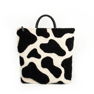 Moo Cow Print Shearling Backpack Black and White image 1