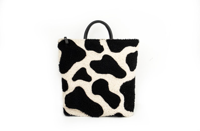 Moo Cow Print Shearling Backpack Black and White image 1