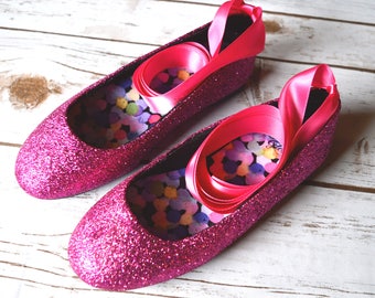 pink and black ballet flats