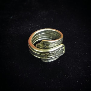 Spoon wrap ring made from antique silver plate silverware.
