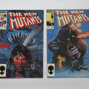 May include: Two Marvel comic books, The New Mutants issue 18 and issue 19. Issue 18 features a character with a mark on their forehead and the text Demon Bear. Issue 19 depicts a large bear creature and a glowing figure against a blue background.