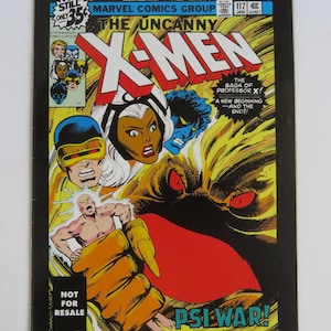 May include: A comic book cover featuring the X-Men. The cover is yellow, red, and black with a large image of the X-Men logo. The text on the cover reads "The Uncanny X-Men" and "The Saga of Professor X!"  The cover also features a large image of Storm, a character from the X-Men, with a yellow and red background.