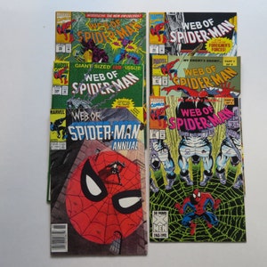 May include: A collection of eight vintage comic books featuring Spider-Man. The covers are colorful and feature various illustrations of Spider-Man in action. The titles include "Web of Spider-Man" and "Spider-Man Annual".