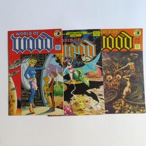 May include: Three comic books titled World of Wood, issues 2, 3, and 4. The covers feature colorful illustrations of science fiction and fantasy scenes, including characters, creatures, and landscapes, with the Eclipse Comics logo visible on each.