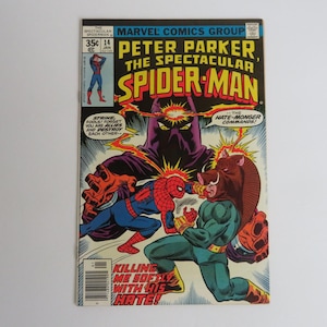 May include: Comic book cover featuring Spider-Man in a red and blue suit fighting a villain with a boar head. The cover text reads "Peter Parker, The Spectacular Spider-Man" and "The Hate-Monger Commands!"