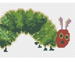 May include: A green caterpillar with a red head and purple antennae. The caterpillar is made of felt and has a simple, cartoon-like design.
