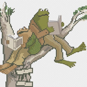 Könnte beinhalten: Zwei Frösche sitzen auf einem Baumzweig und lesen Bücher. Der Frosch links ist braun und grün und der Frosch rechts ist grün mit braunen Hosen. Der Frosch links hält ein weißes Buch und der Frosch rechts hält ein hellbraunes Buch.