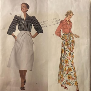 May include: Vogue Paris Original sewing pattern featuring two Givenchy designs. One design includes a striped blouse and a white skirt. The other design features a floral print skirt and a solid-colored blouse. The pattern number is 1651.